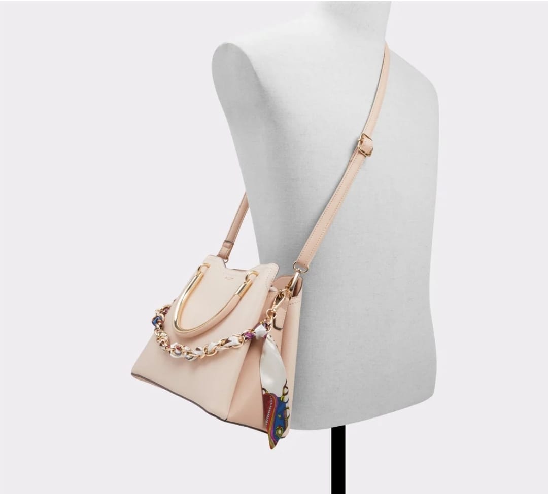 ALDO beige shoulder bag with gold hardware and decorative scarf