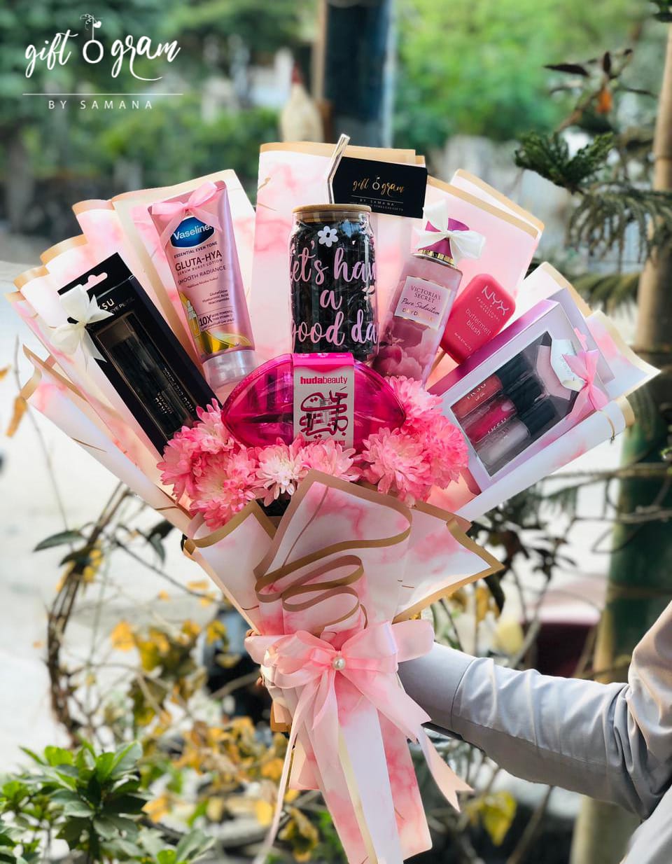 Makeup Bouquet Gift with Beauty Products, Pink Wrapping & Flowers β Giftogram by Samana Karachi