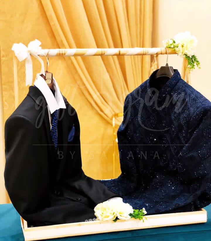 Wooden cart bridal and groom gift packaging with floral décor and dress display