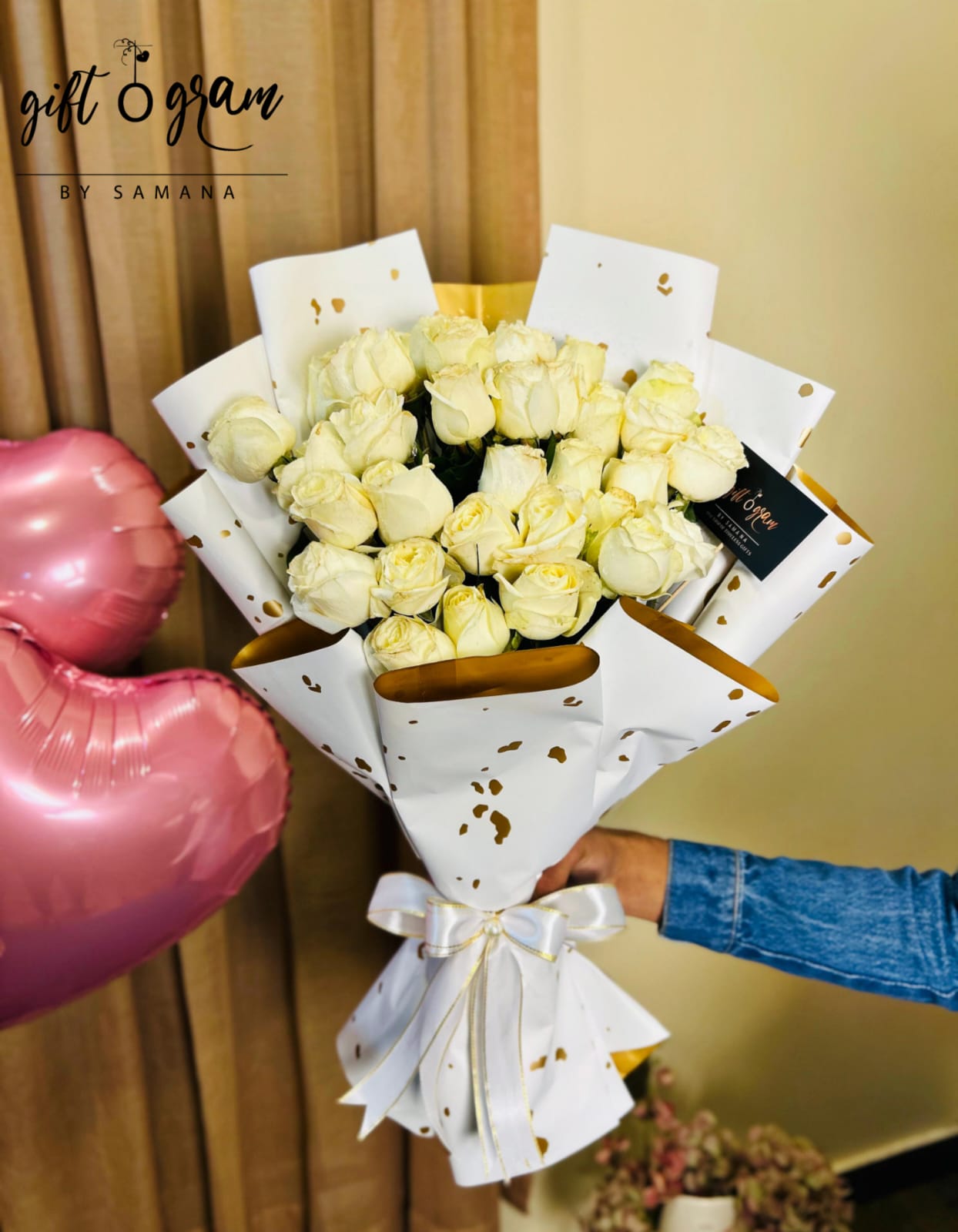 White roses bouquet wrapped in gold-white luxury paper with ribbon – Giftogram by Samana Karachi