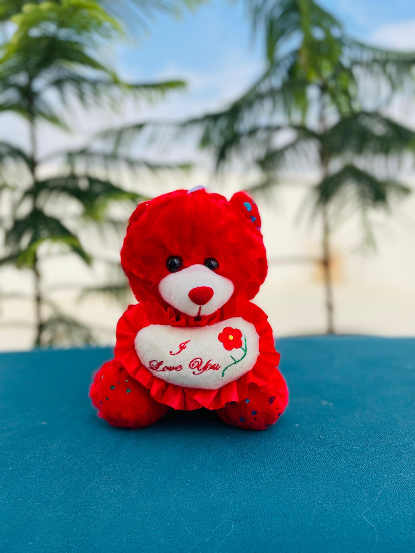 Red teddy bear with I love you heart