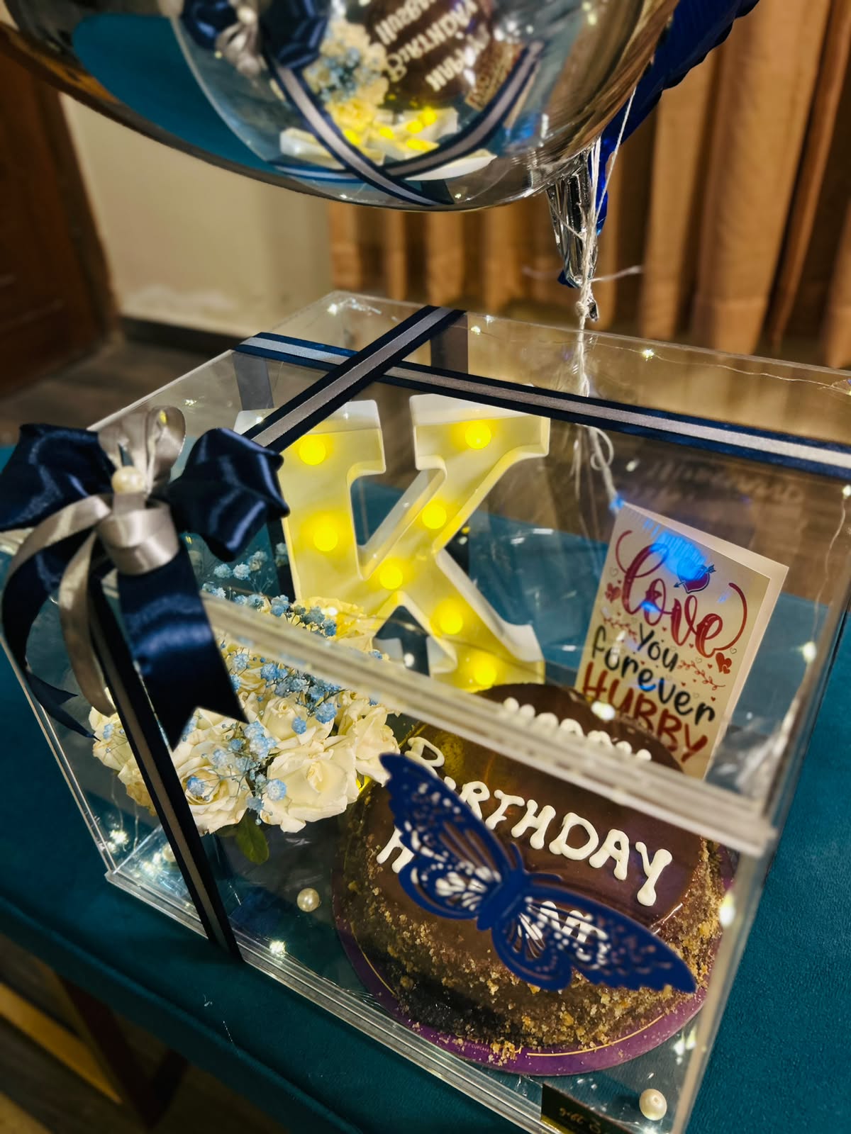 Blue and silver birthday balloon bouquet with cake gift box
