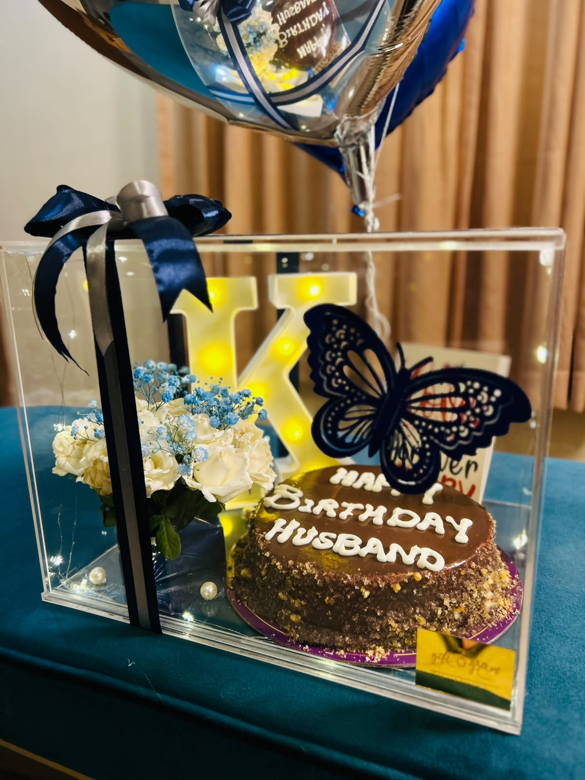 Blue and silver birthday balloon bouquet with cake gift box