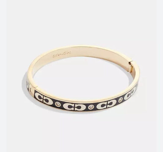 Coach signature gold bangle bracelet with crystal accents