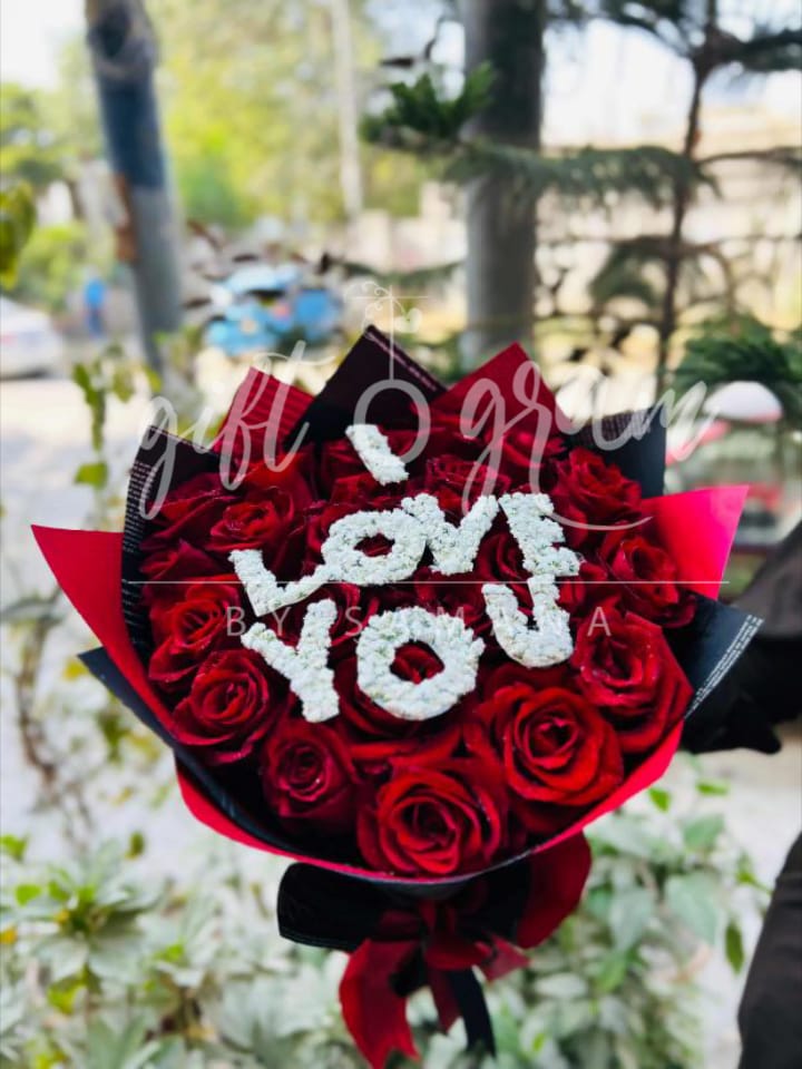 I Love You red roses bouquet with white floral lettering.