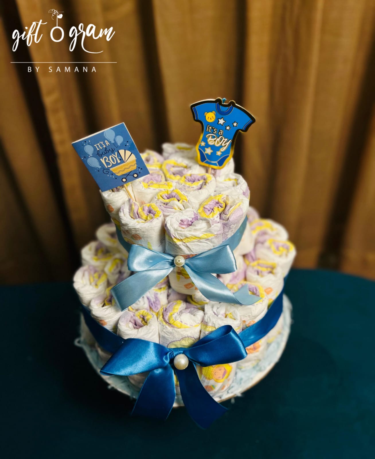 Baby boy diaper cake with blue ribbons and “It’s a Boy” theme – newborn gift in Karachi