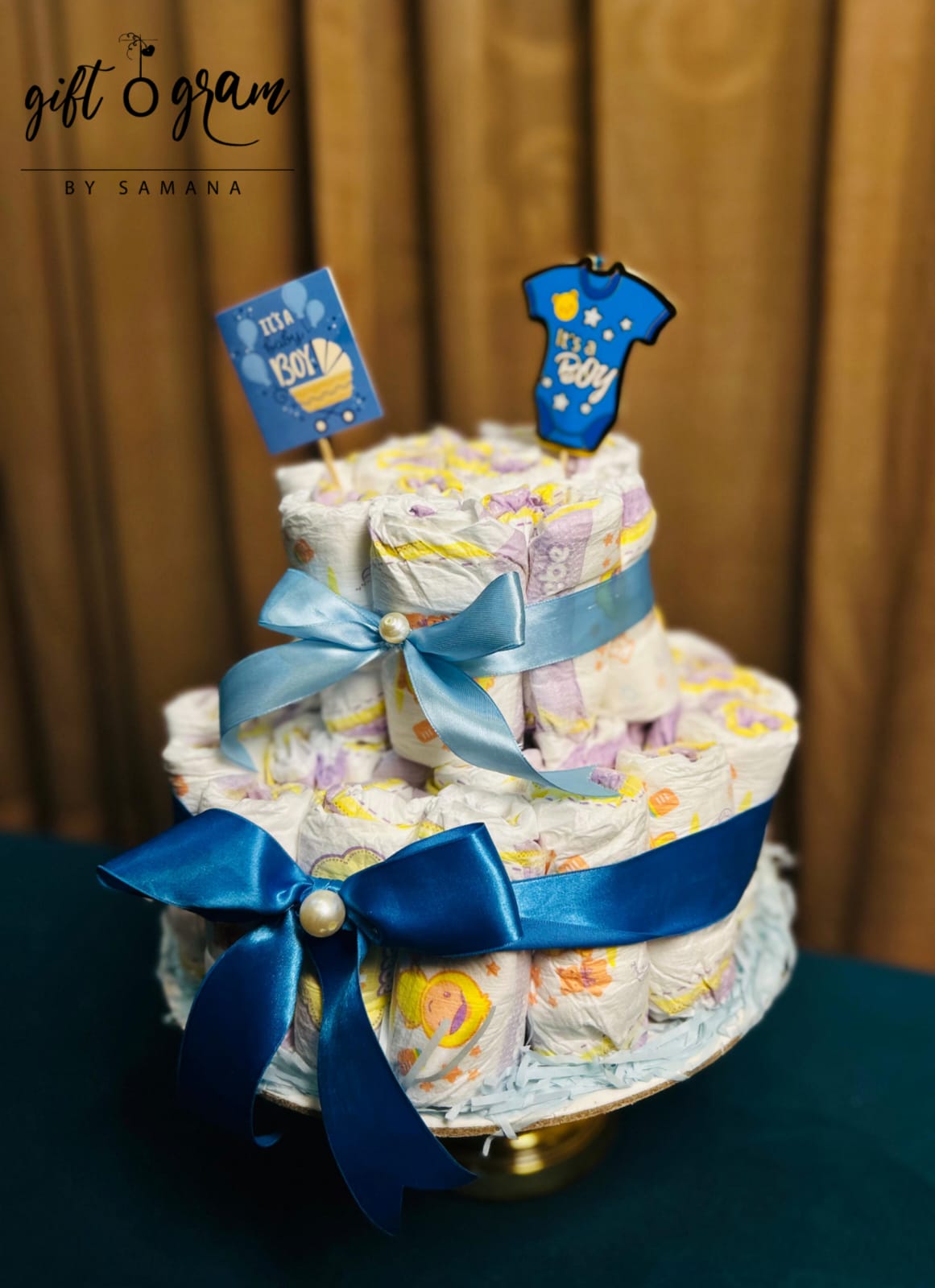Baby boy diaper cake with blue ribbons and “It’s a Boy” theme – newborn gift in Karachi Pakistan