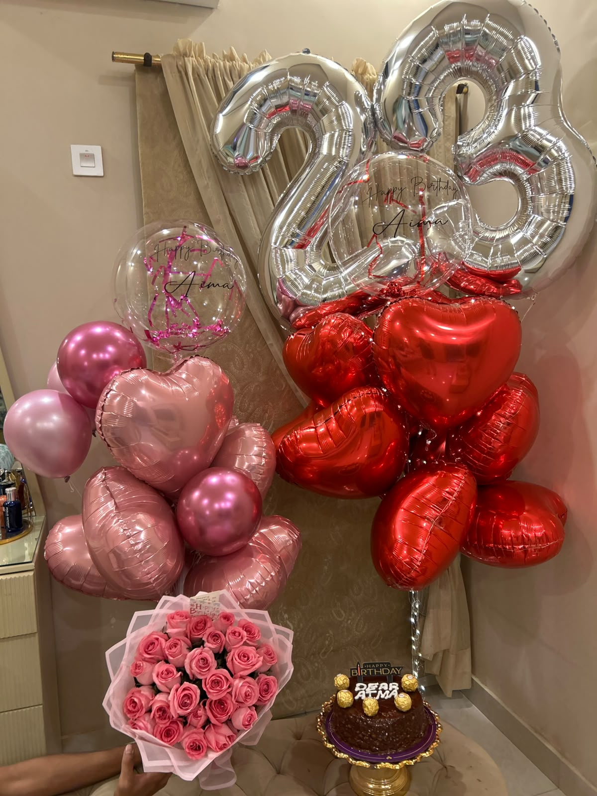 Ultimate birthday surprise with balloons roses and cake