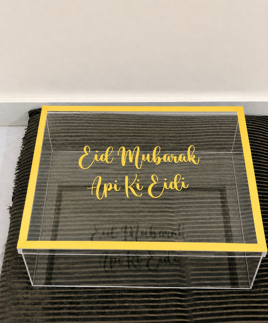 Premium clear acrylic suit box for luxury clothing gift packaging, unstitched suits, dresses, and festive gift presentation.