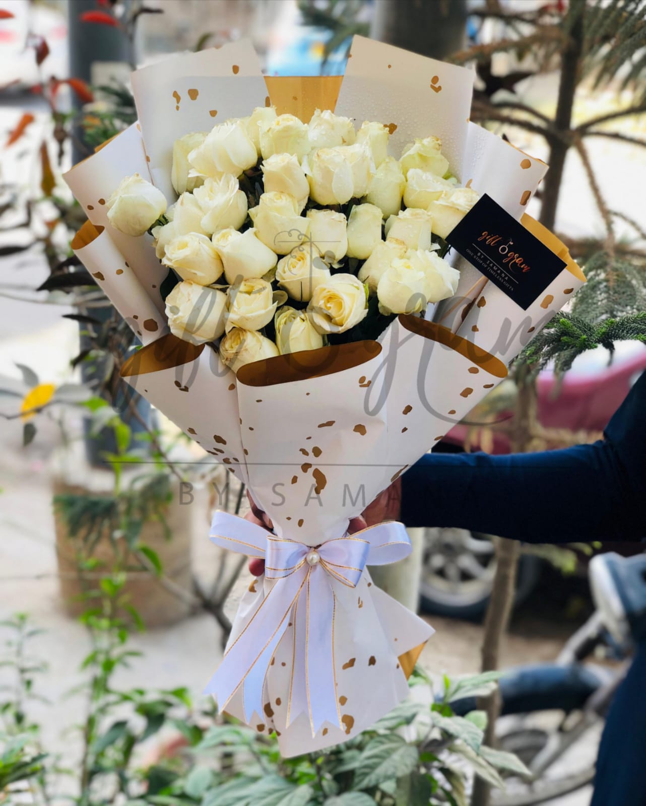 White roses bouquet wrapped in gold-white luxury paper with ribbon – Giftogram by Samana Karachi