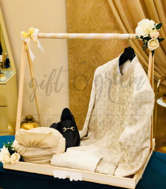 Wooden cart bridal and groom gift packaging with floral décor and dress display