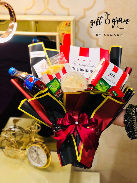 Luxury KFC bouquet gift hamper with Pepsi, fries, sauces, premium wrapping, and decorative ribbon.