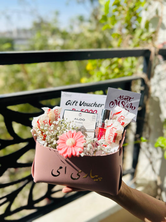 Mother’s Day gift pouch with jewelry chocolates gift voucher and floral arrangement for mom in Pakistan